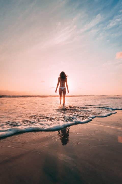 https://www.pexels.com/photo/back-view-beach-bikini-dawn-1142987/