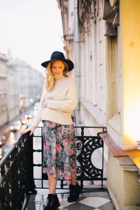 https://www.pexels.com/photo/pregnant-woman-wearing-white-sweater-and-multicolored-floral-skirt-standing-on-balcony-879805/