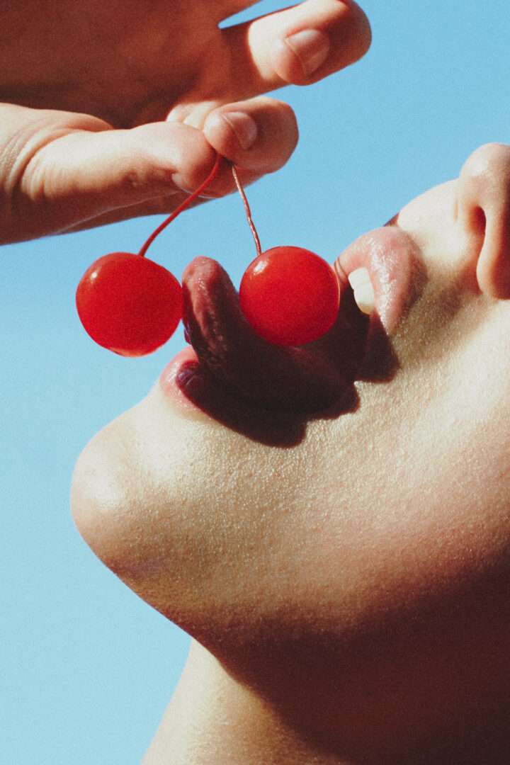 EMIL ÉLISE - Melting Lust - Woman licking cherries