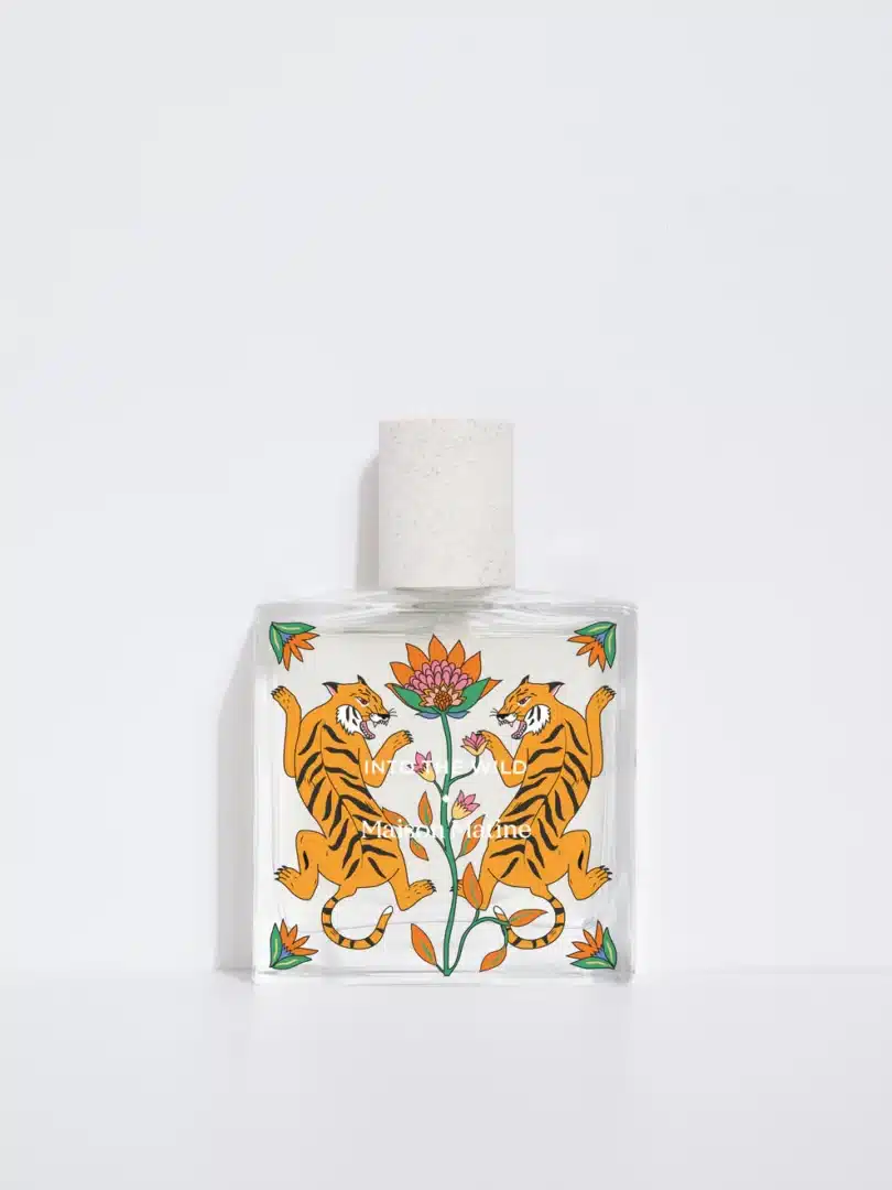 Flakon von Maison Matine Into the Wild aus der Origine Collection. Das Eau de Parfum ist mit einer Illustration von zwei Tigern verziert, die sich um eine exotische Blume ranken, und steht für eine tropische Expedition in die wilde Natur.