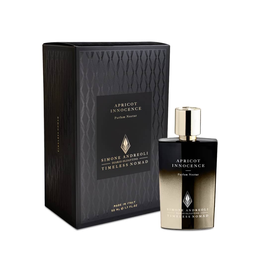 Flacon and packaging of Apricot Innocence from the Timeless Nomad Collection by Simone Andreoli, elegantly staged in black and gold.
