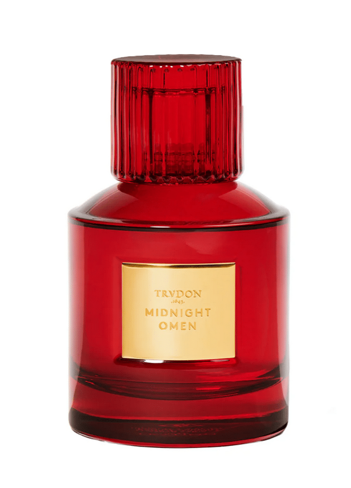Red perfume bottle Trudon Midnight Omen with golden lettering, part of the Nuit Rouge Collection by Trudon.