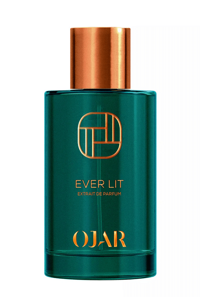 Bottle of the Extrait de Parfum Ever Lit by Ojar in a deep green glass bottle with a copper-colored cap against a white background.