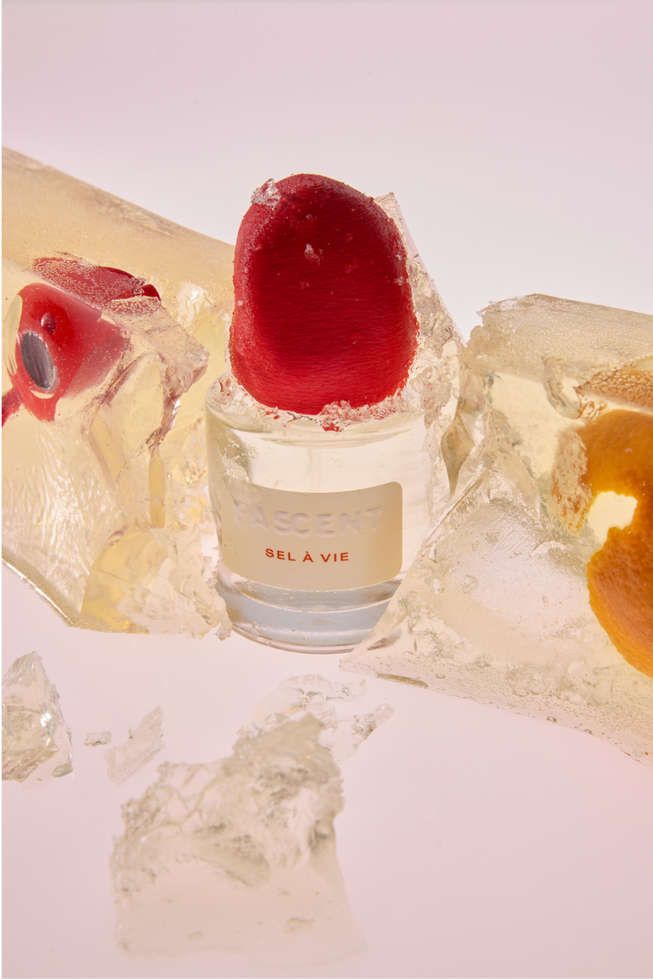Fascent Sel à Vie Eau de Parfum Fascent Sel à Vie Eau de Parfum - Fascent brand perfume bottle with red cap, staged in transparent ice with citrus accents