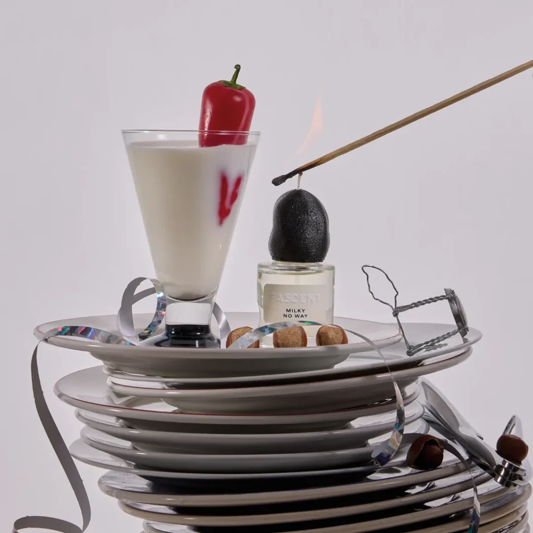 Fascent Milky No Way Eau de Parfum Fascent Milky No Way Eau de Parfum - Fascent brand perfume bottle in a staged still life with crockery, glass and red chili pepper